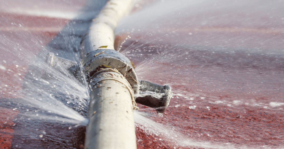 Plumber inspecting water system and pipes during summer plumbing maintenance in Champaign IL